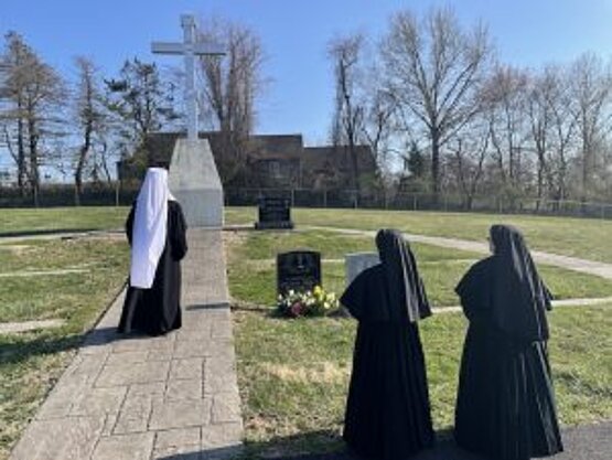 Metropolitan Borys prays at the graves of the deceased at the Ukrainian Cemetary in Longhorn, PA.